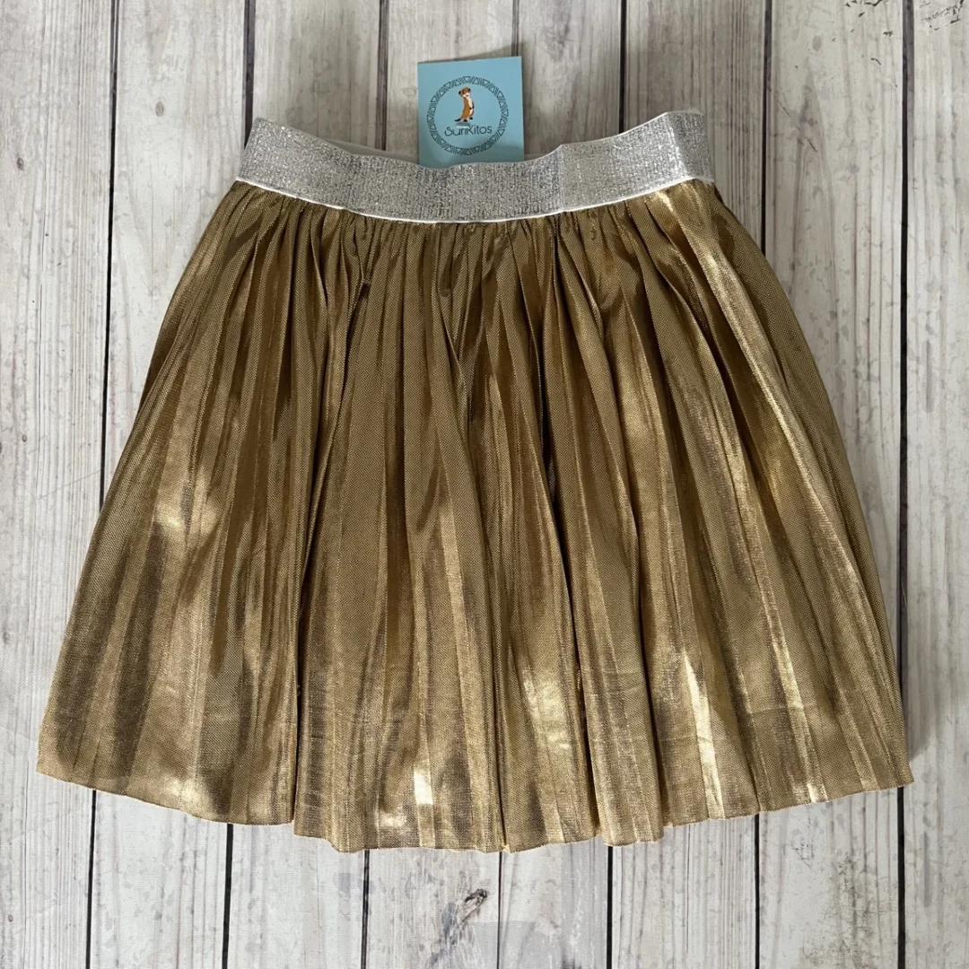 POLLERA METALIZADA DORADA . LINEA IMPORTADA