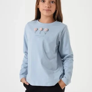 REMERA DAPHNE CELESTE . LÍNEA IMPORTADA