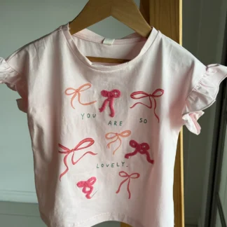 REMERA MOÑO ROSA . LÍNEA IMPORTADA