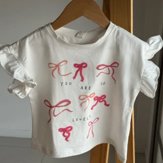REMERA MOÑO BLANCA. LÍNEA IMPORTADA
